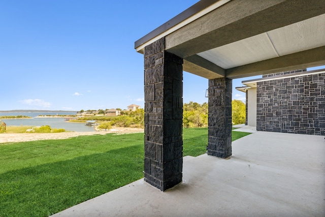 view of patio / terrace with a water view