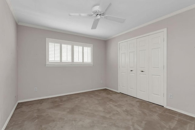 unfurnished bedroom with baseboards, carpet, ornamental molding, and a closet