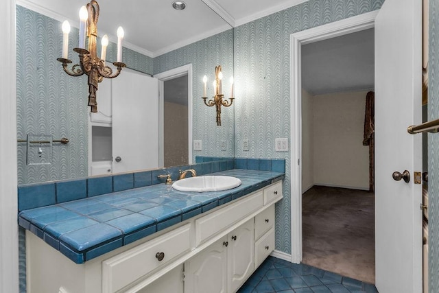 bathroom featuring tile patterned flooring, crown molding, vanity, and wallpapered walls