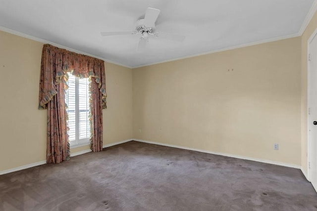 empty room featuring ornamental molding, carpet flooring, baseboards, and a ceiling fan