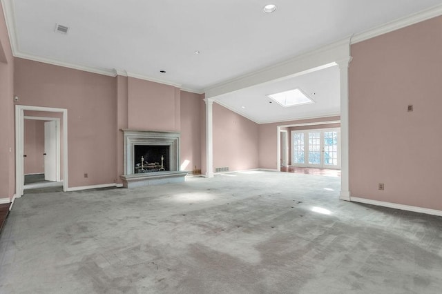 unfurnished living room with ornamental molding, carpet flooring, visible vents, and ornate columns