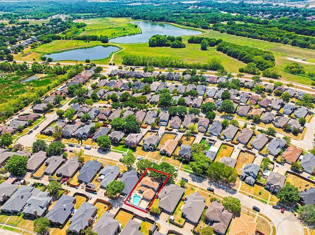 birds eye view of property featuring a water view and a residential view