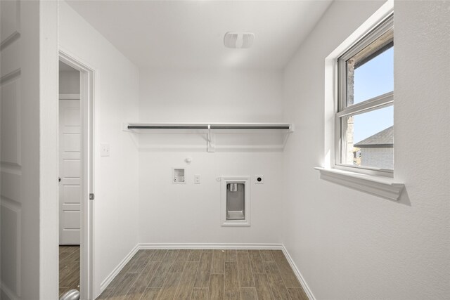 laundry area featuring wood finished floors, baseboards, gas dryer hookup, laundry area, and electric dryer hookup