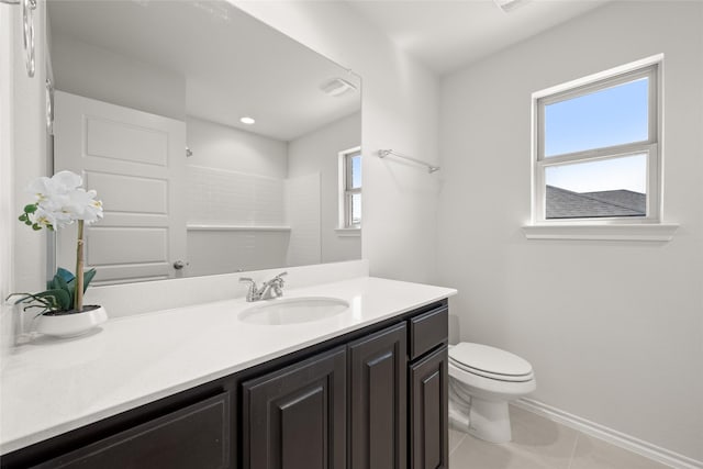 bathroom featuring toilet, tile patterned flooring, a shower, baseboards, and vanity