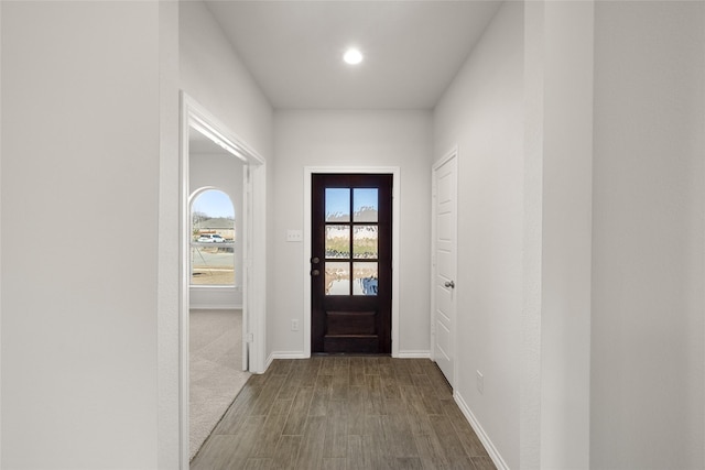 foyer featuring recessed lighting, baseboards, and dark wood finished floors