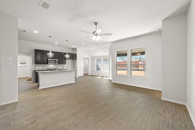 unfurnished living room featuring light wood finished floors, visible vents, recessed lighting, and a ceiling fan