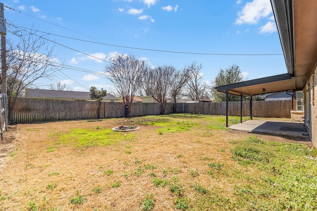 view of yard with a patio area and a fenced backyard