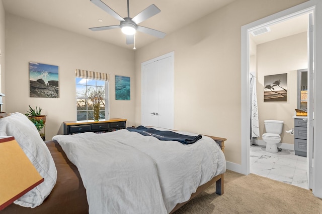 bedroom with marble finish floor, visible vents, light carpet, ensuite bath, and baseboards