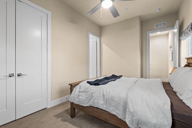 bedroom with ceiling fan, visible vents, and baseboards