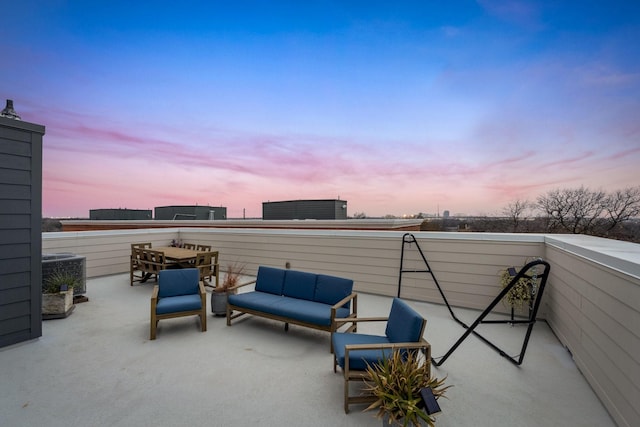 view of patio / terrace featuring a balcony, central AC unit, and outdoor lounge area