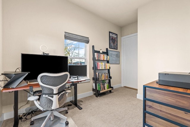 office space featuring baseboards and carpet flooring