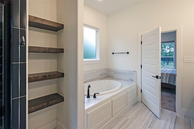 bathroom with a bath and ensuite bathroom