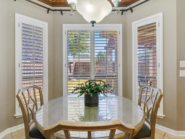 dining room featuring tile patterned flooring and baseboards