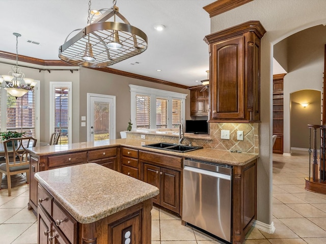 kitchen featuring tasteful backsplash, arched walkways, dishwasher, ornamental molding, and a sink