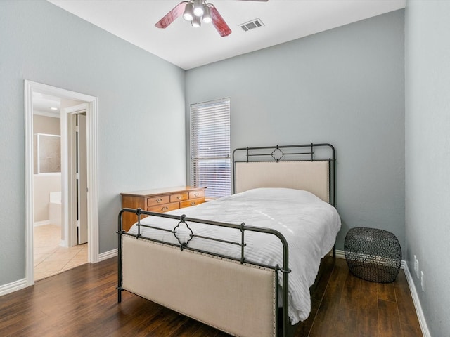 bedroom with visible vents, ceiling fan, baseboards, and wood finished floors