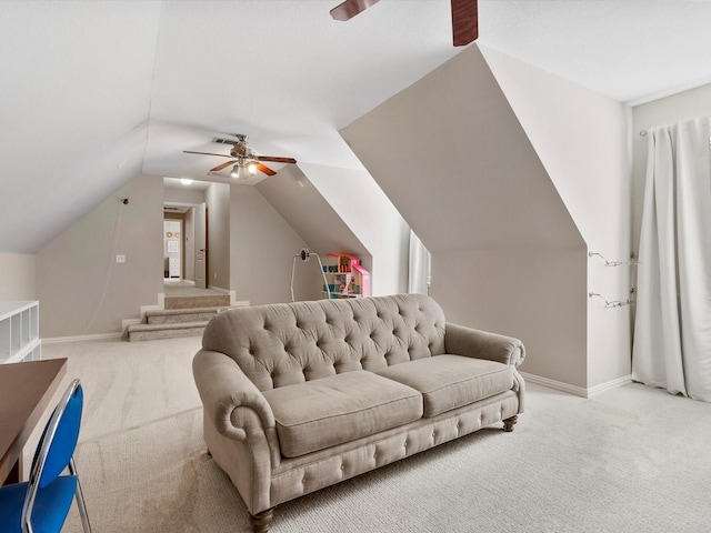 interior space with carpet, ceiling fan, lofted ceiling, and baseboards