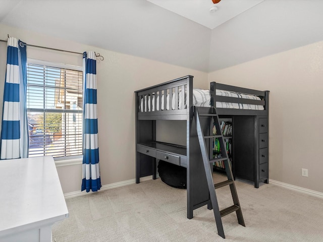 bedroom featuring vaulted ceiling, carpet, and baseboards