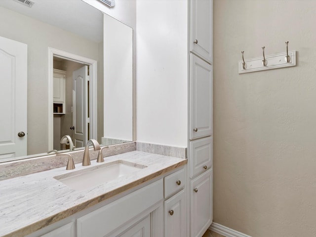 bathroom featuring visible vents and vanity