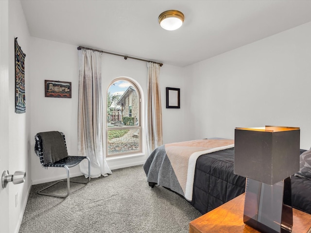 bedroom with carpet and baseboards