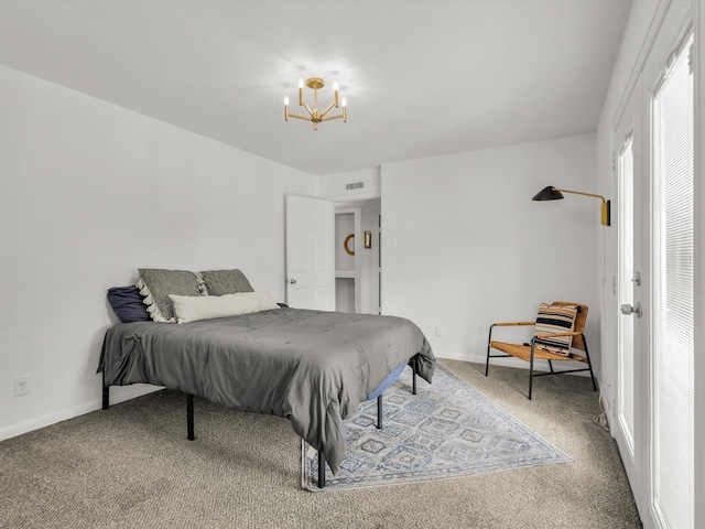 bedroom with a notable chandelier, carpet flooring, visible vents, and baseboards