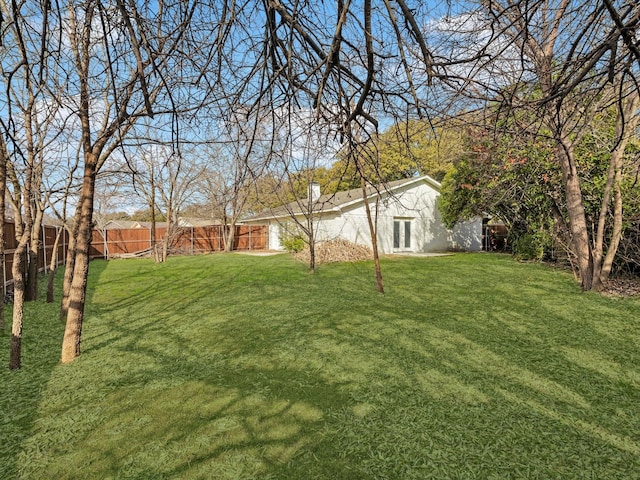 view of yard with a fenced backyard