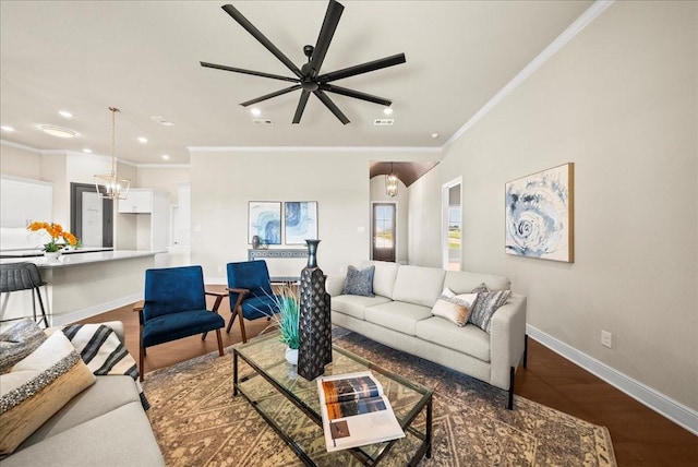 living area featuring recessed lighting, baseboards, wood finished floors, and crown molding