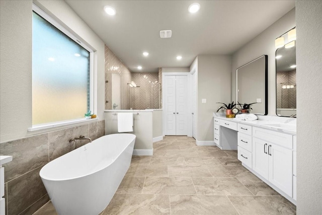 full bath with recessed lighting, vanity, walk in shower, and a freestanding tub