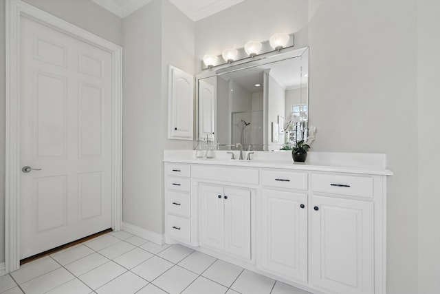 bathroom featuring ornamental molding, tile patterned flooring, a shower, and vanity