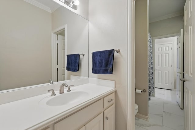 full bathroom with toilet, vanity, baseboards, marble finish floor, and crown molding