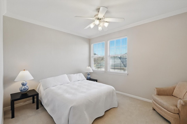 bedroom featuring ceiling fan, baseboards, crown molding, and light colored carpet