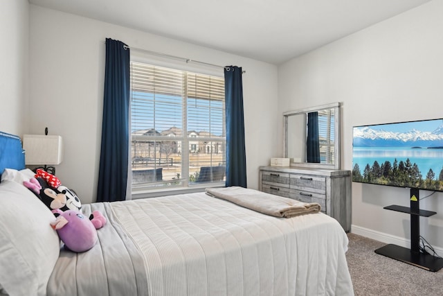 bedroom featuring baseboards and carpet floors