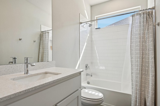 full bath with vanity, toilet, and shower / bath combo with shower curtain