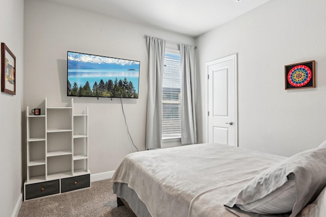 carpeted bedroom with baseboards