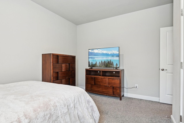 carpeted bedroom featuring baseboards