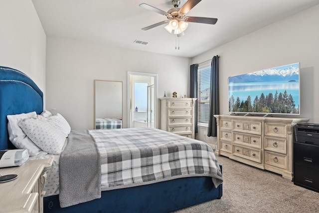 bedroom with visible vents, carpet, and a ceiling fan