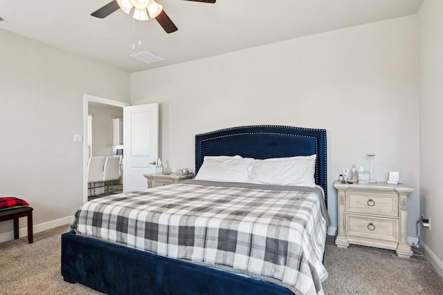 carpeted bedroom with visible vents, ceiling fan, and baseboards