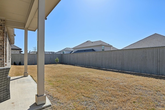 view of yard with a fenced backyard