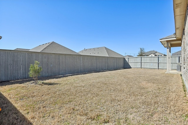 view of yard with a fenced backyard