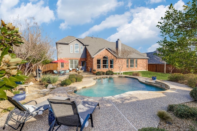 view of pool with a fenced in pool, a fenced backyard, and a patio