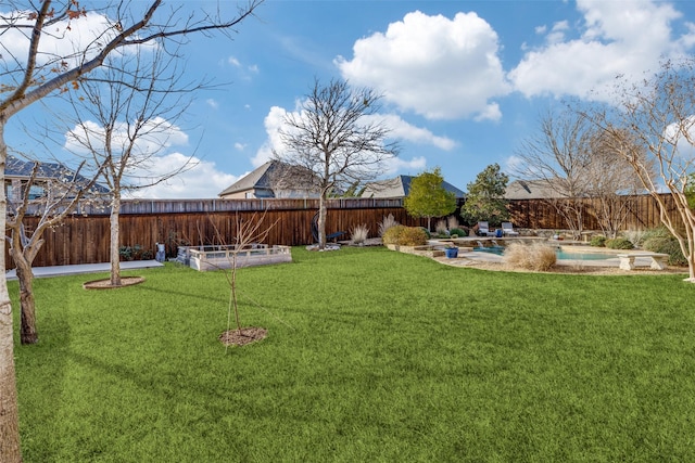 view of yard with a fenced backyard and a fenced in pool