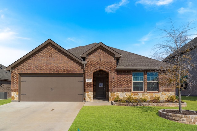 view of front of property with brick siding, driveway, a shingled roof, and stone siding