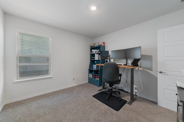 carpeted office featuring baseboards