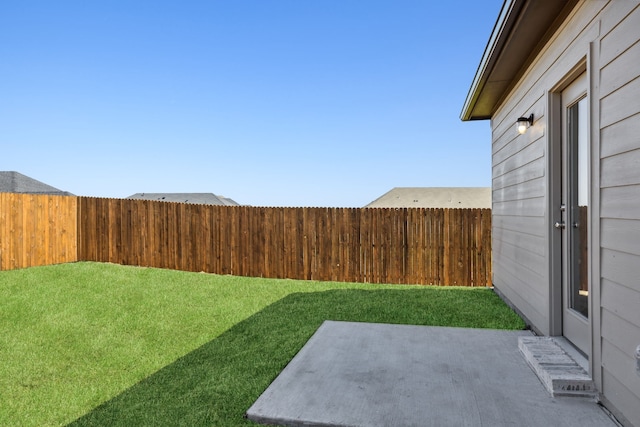 view of yard with a patio and fence