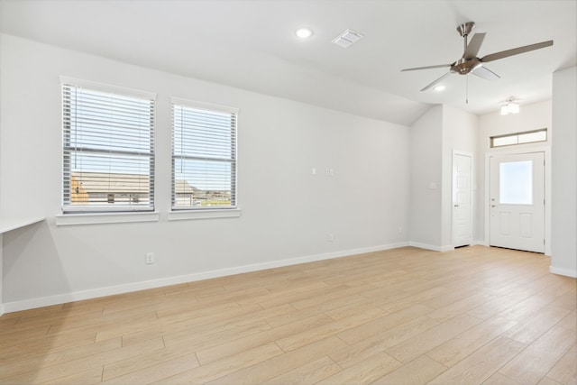 empty room featuring light wood finished floors, recessed lighting, visible vents, a ceiling fan, and baseboards