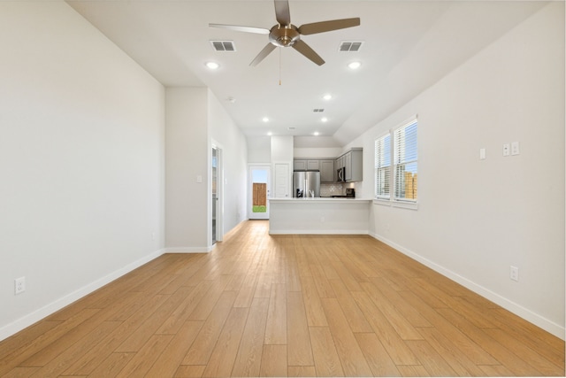 unfurnished living room with light wood finished floors, visible vents, and recessed lighting