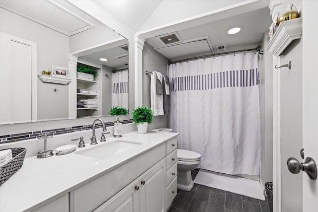 full bathroom with decorative columns, a shower with shower curtain, toilet, vanity, and wood finished floors