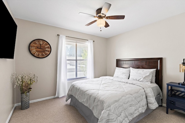 bedroom with carpet floors, a ceiling fan, and baseboards