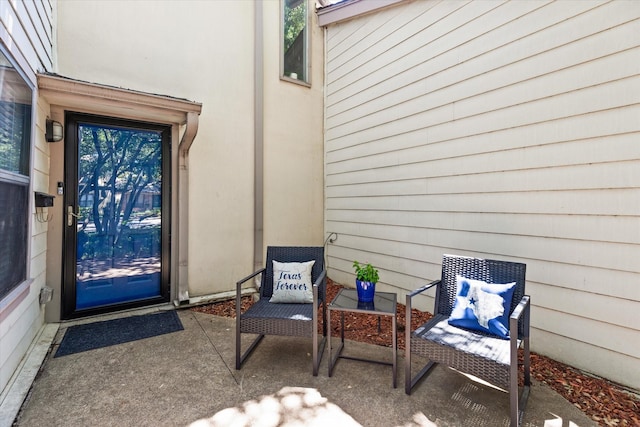 doorway to property with a patio area