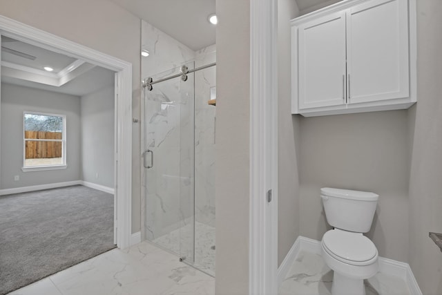 full bath featuring a marble finish shower, marble finish floor, toilet, and baseboards