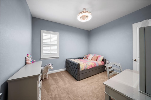 bedroom featuring baseboards and light colored carpet